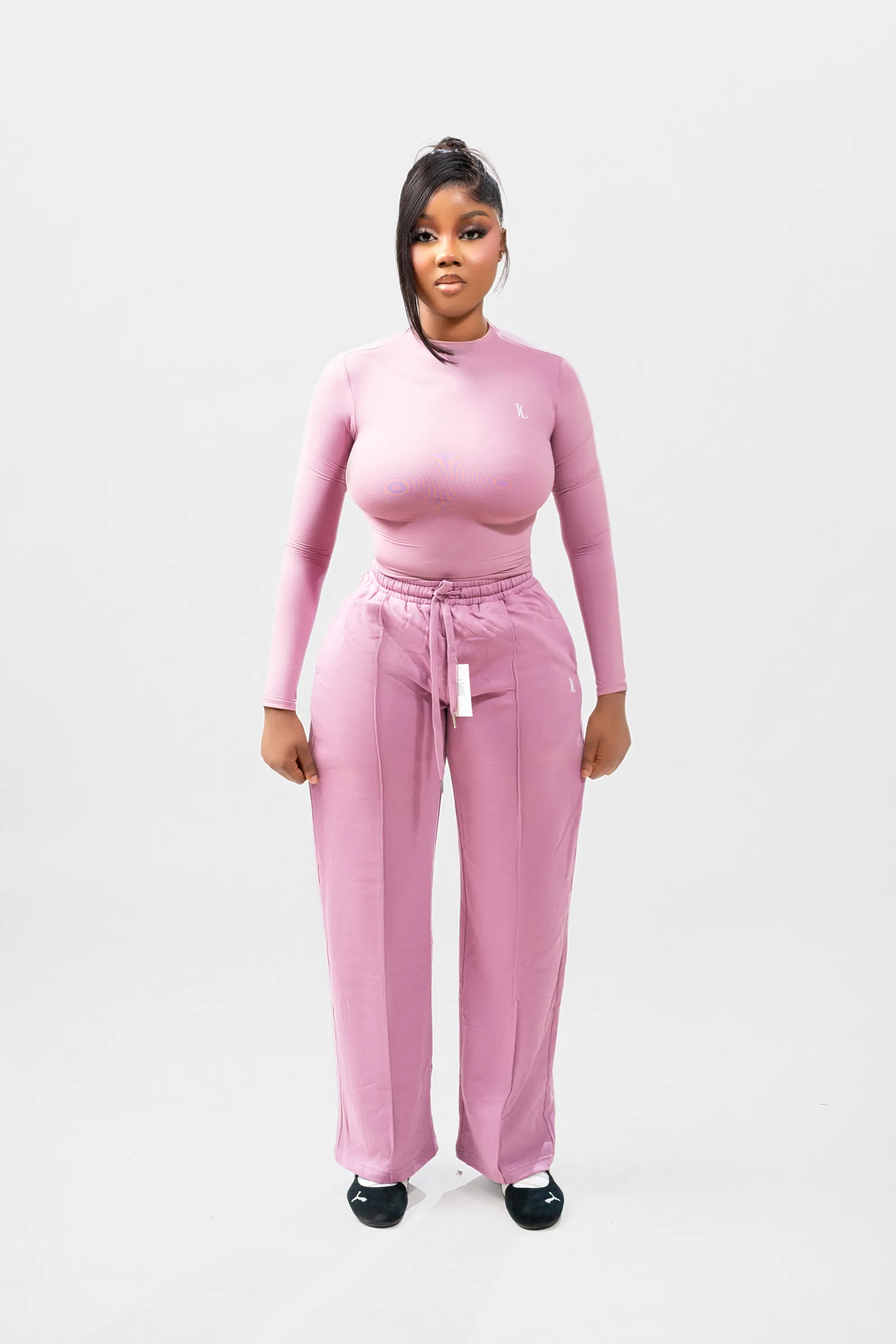 Pink activewear set, front standing pose