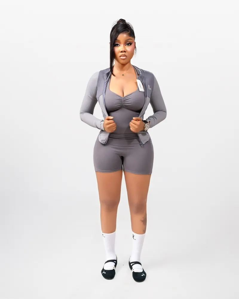 Grey activewear, unzipping jacket, front pose