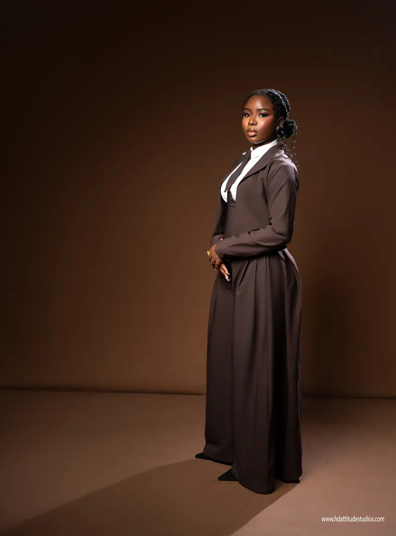 Vintage-styled brown trench/tie look, moody monochrome brown studio backdrop