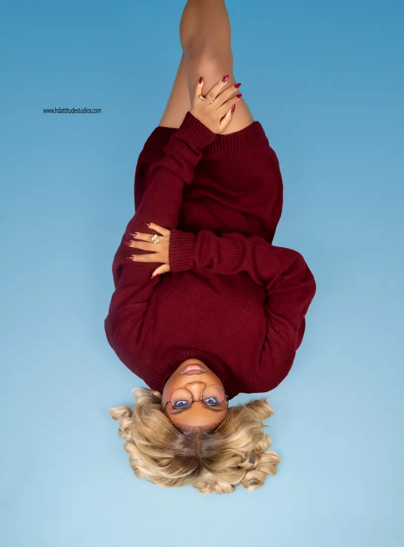 Same burgundy set, striking inverted/upside-down conceptual pose