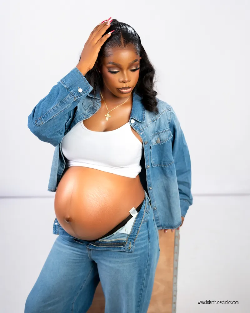 Same denim maternity set, close belly reveal with hand in hair