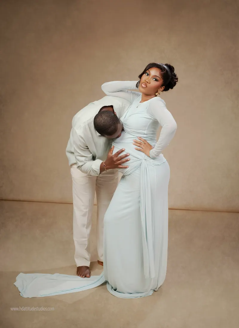 Same couple maternity set, husband kissing belly, wife looking to camera