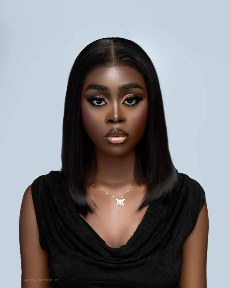 Clean beauty headshot, sleek black bob, soft gray backdrop