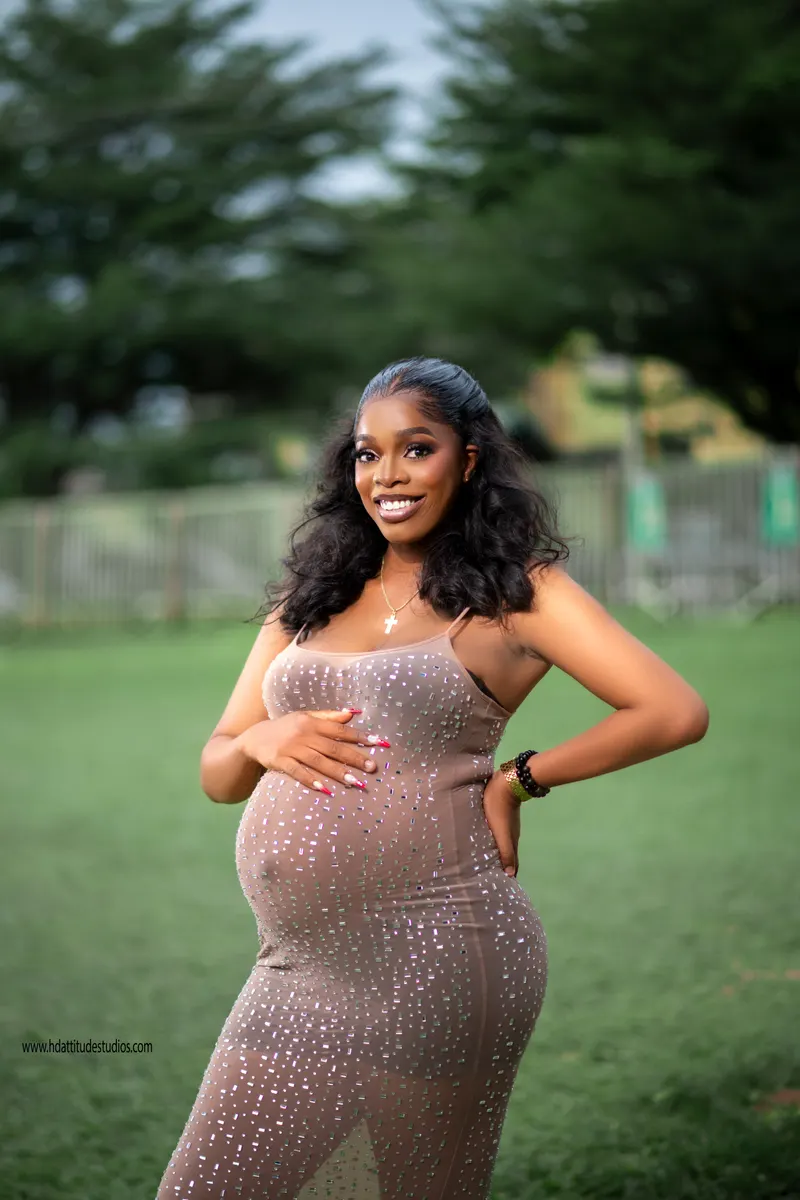 Outdoor maternity portrait, sparkly nude gown, golden-hour park/grass backdrop